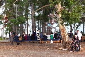 A wedding ceremony at the shack near Bruny Island Lodge looking over the bay.