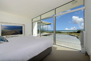 Bedroom with a full ceiling to floor view