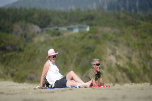 Couple enjoying the sunshine and sand