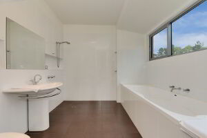 Master bedroom ensuite bathroom with bathtub and shower facility