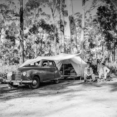 Historical photo of Alf Holding and Roy Taylor at Cloudy Bay entrance with their caravan