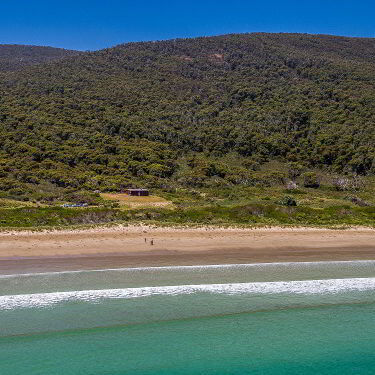 View of Cloudy Bay Cabin and the beach on Bruny Island