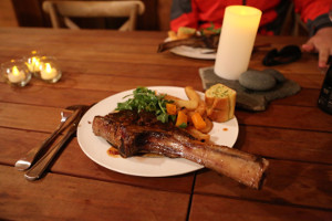 The fresh produce on the island is amazing. This rib eye steak from Snug butcher is nearly as big as the plate.